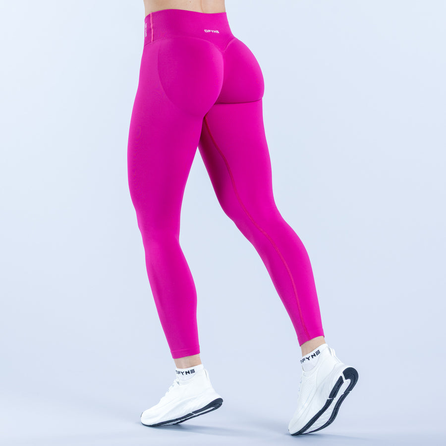 Magenta high-rise leggings with seamless fit and full-length back view.
