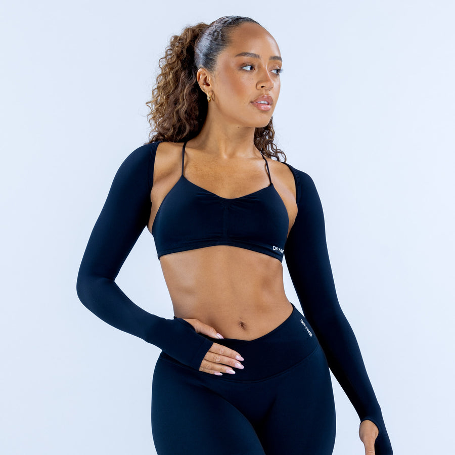 Vision shrug long dark sleeves, front view with cutout neckline straps