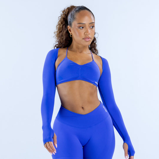 Blue long-sleeve shrug, fitted athletic style with straight neckline