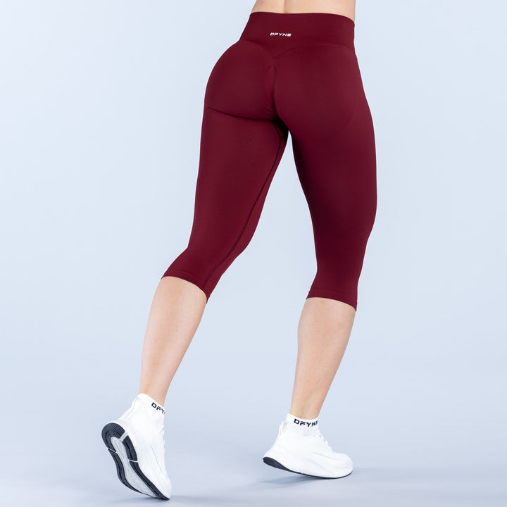Vision capri pants with straight waistband, burgundy stretch knit, back view, 3/4 length