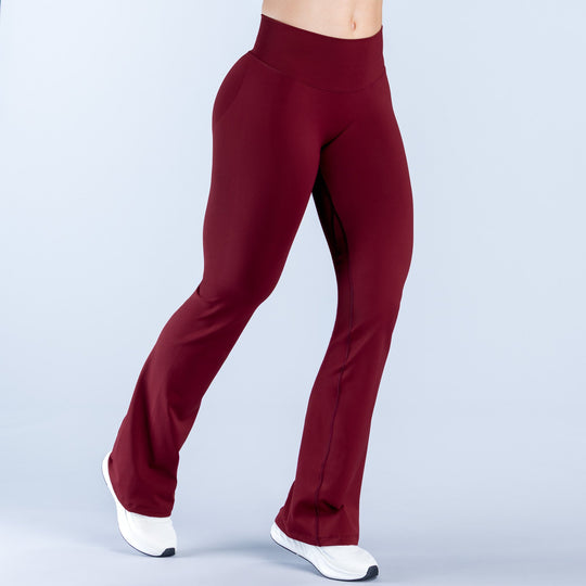 Burgundy flare leggings with straight waistband and wide bell-bottom legs