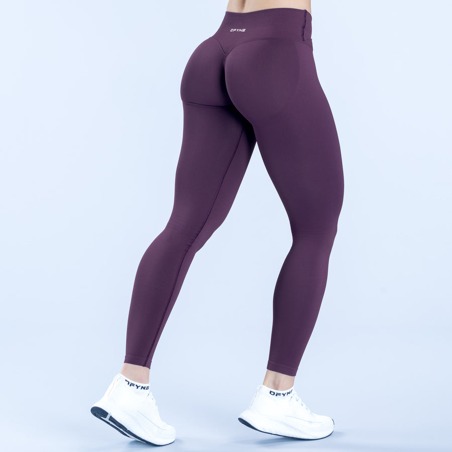 Plum high-rise leggings, rear view with contoured seams and ankle length