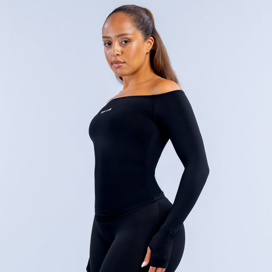 Black off-shoulder long sleeve top, 3/4 back view