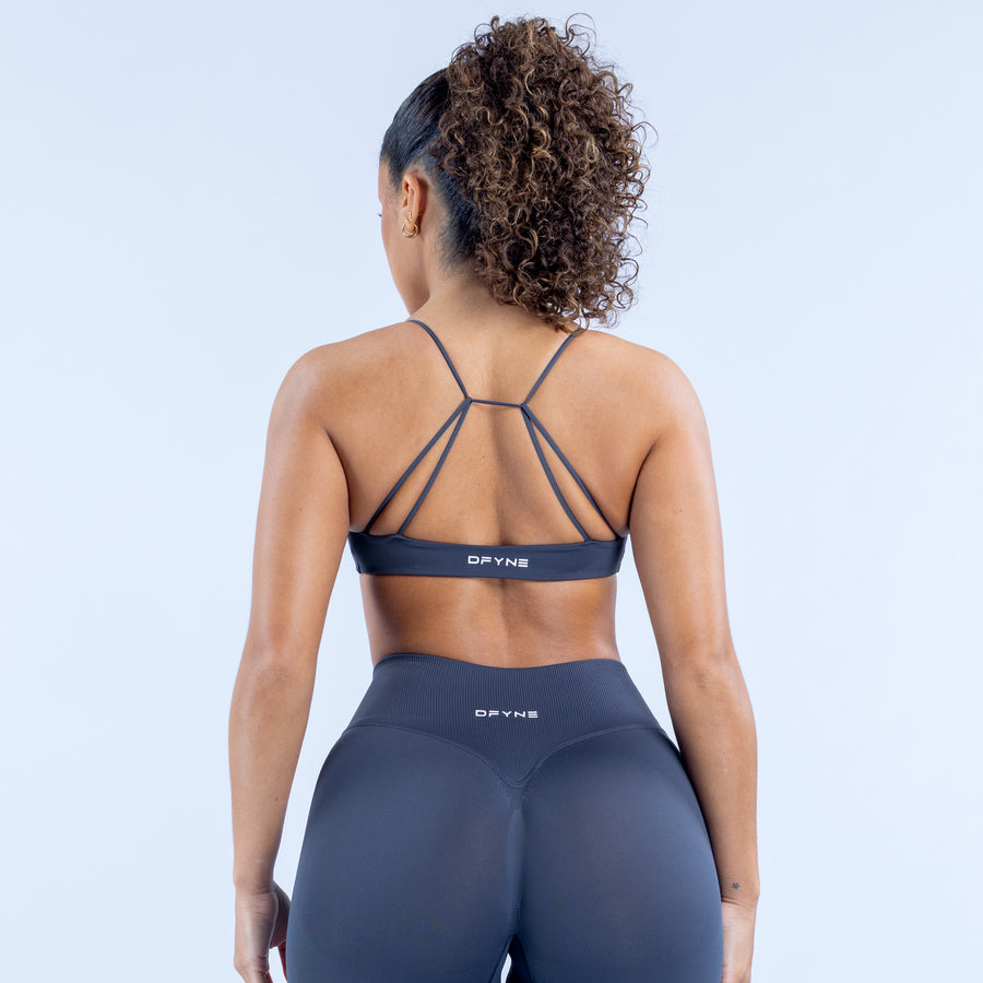 Dark navy sports bra with crisscross back straps and wide elastic band
