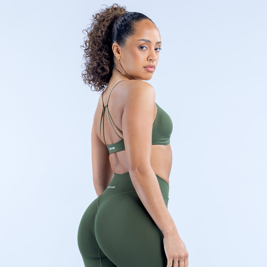 Green twist-front sports bra with thin straps and V neckline
