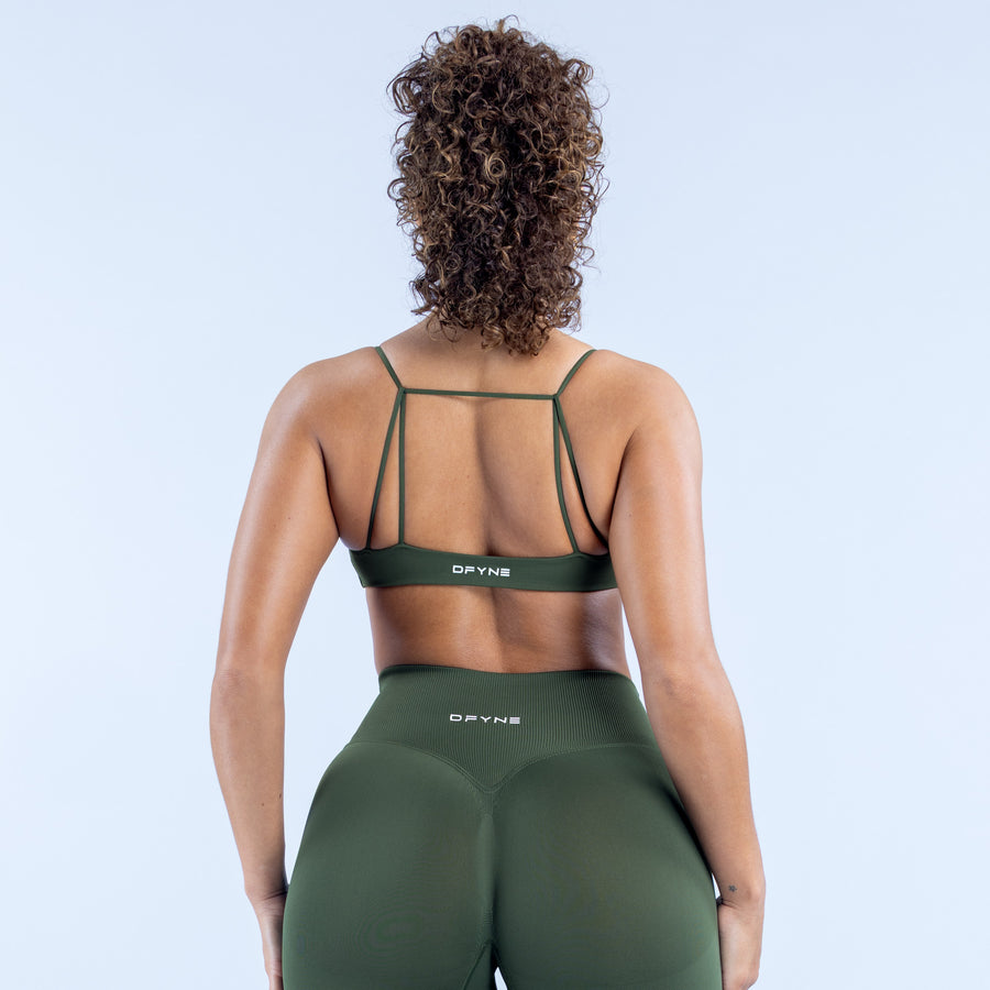 Green sports bra with crisscross back straps and DYPNY logo band