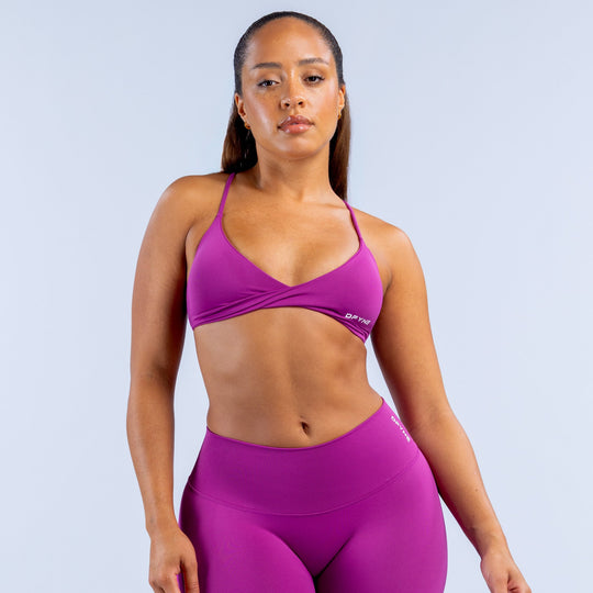 Purple twist-front sports bra with V-neck and racerback straps