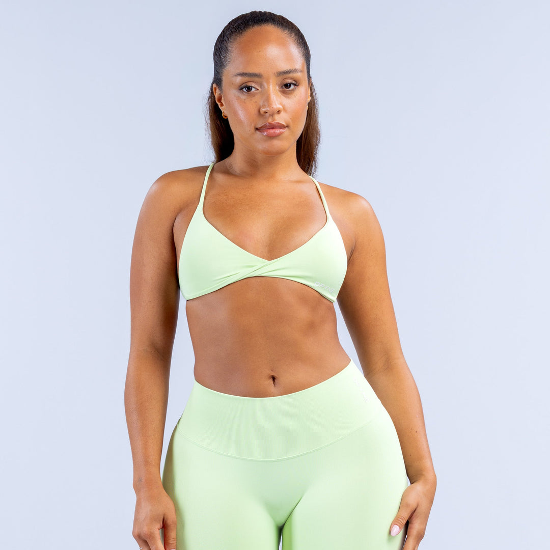 Light green twist-front sports bra with thin straps