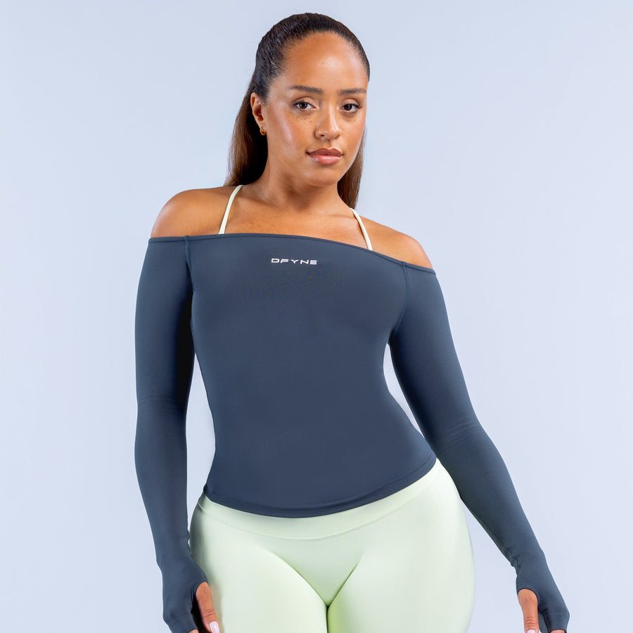Navy long-sleeve off-shoulder performance top with fitted stretch design
