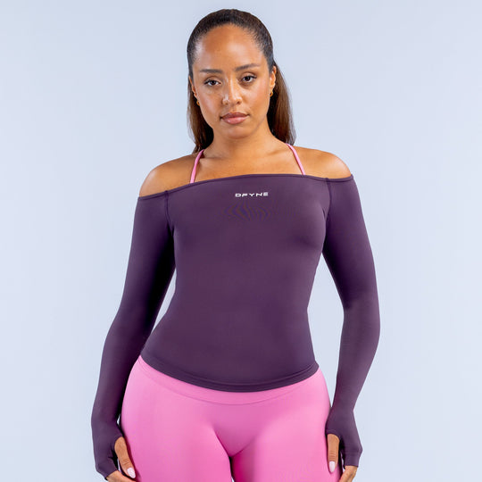 Deep purple off-shoulder long sleeve top with pink shoulder straps and DYFNE logo