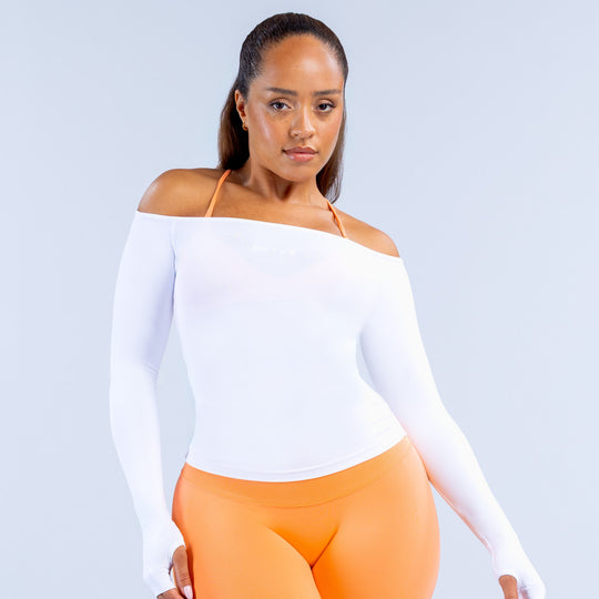 White off-shoulder long sleeve fitted top with straight neckline and hem