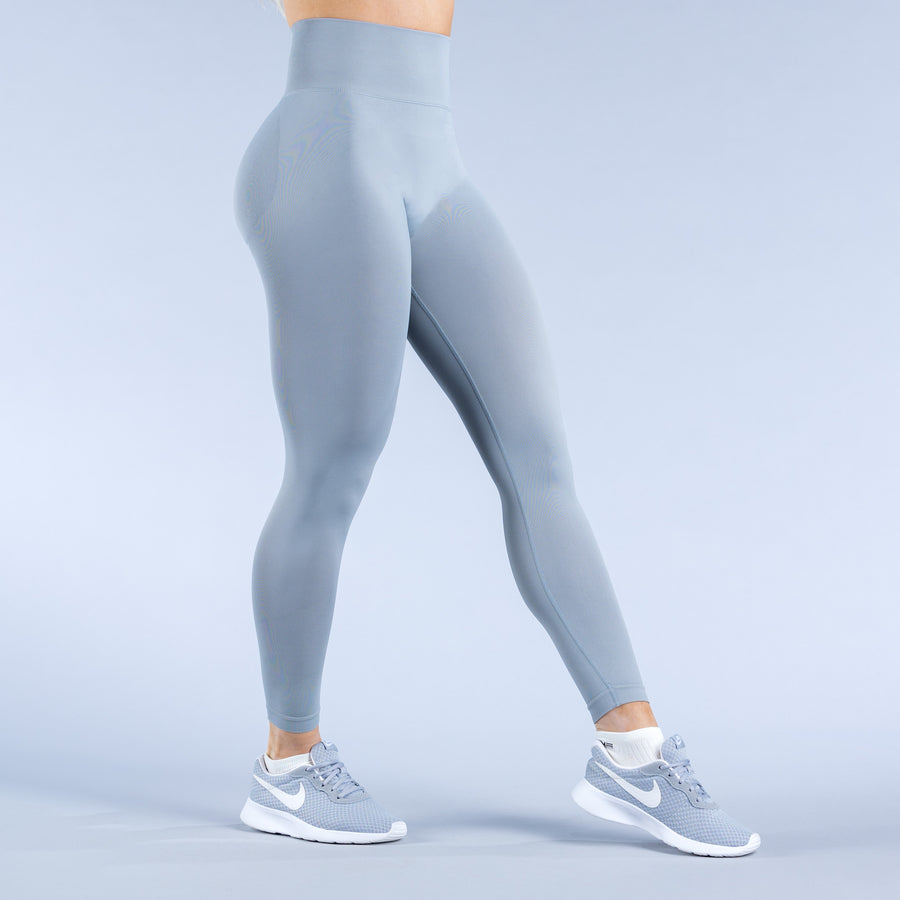 Light blue performance leggings with stretch fabric and curved side panels