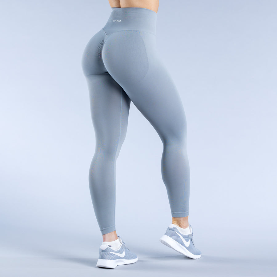 Light blue leggings showing back view with smooth waistband and sculpted fit